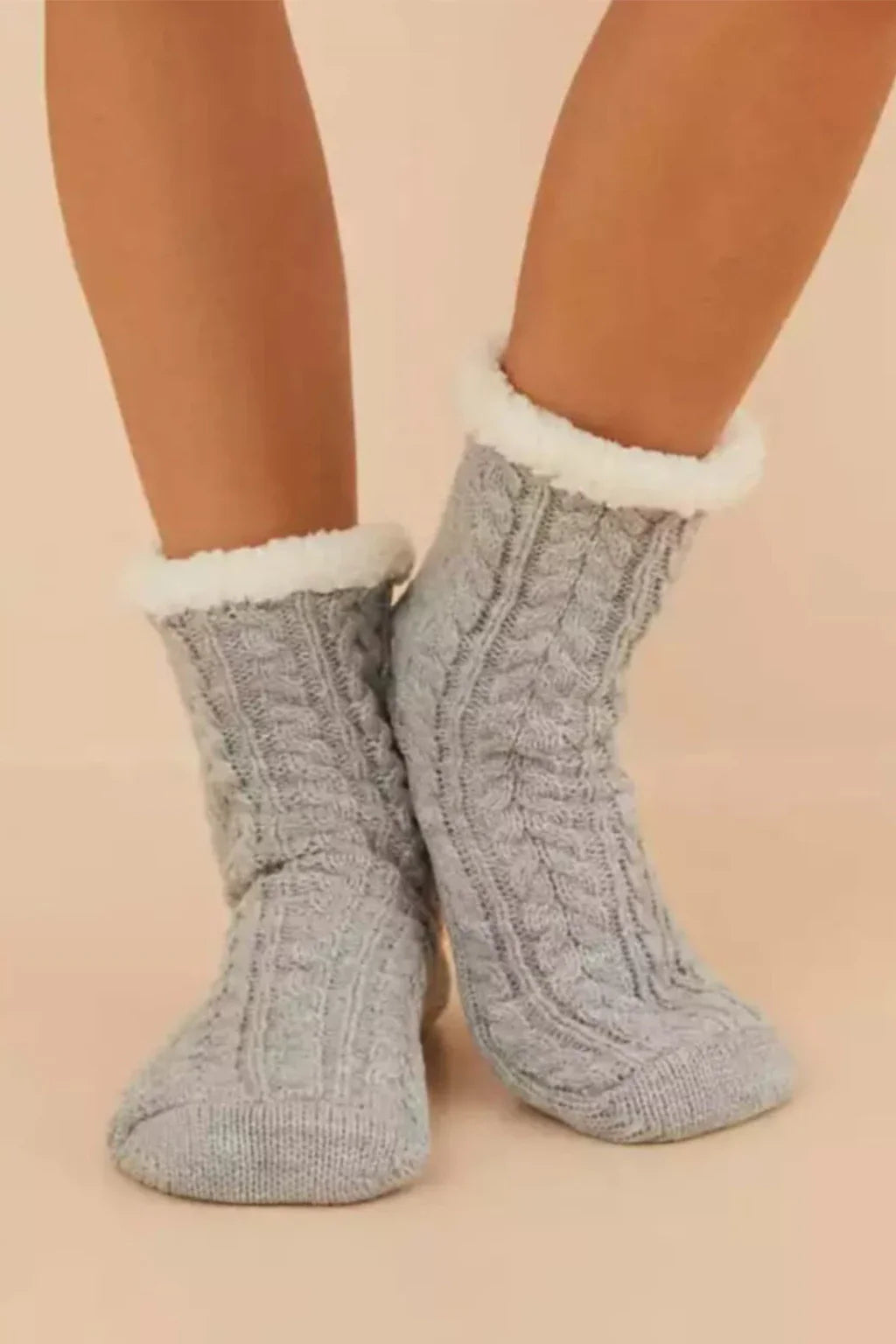Pair Of Aoilai Cable Knit Slipper Socks With A Fleece Lining 